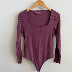 Abercrombie & Fitch Long Sleeve Scoop Neck Bodysuit in Plum